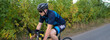 © Solid photos - Young sports man cycling with bicycle on the road in summer