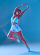 © Georgii - Slim female in activewear dancing with hands up. Fitness, diet, skin and body care. Motion blur effect.