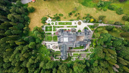 Wall Mural - Aerial drone view of The Peles Castle in Romania