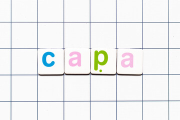 Canvas Print - Colorful tile letter in word CAPA (abbreviation of corrective action and preventive action) on white grid background