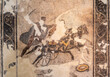 Close-up on ancient roman mosaic in ruins representing a man driving a chariot