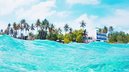 Wall Mural - Tropical blue sea with island. Splitted view of the tropical island and the sea in the Maldives