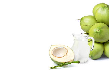 Wall Mural - Glass jug of coconut water and young green coconut fruit isolated on white background with copy space.