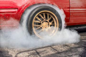 Wall Mural - Drag racing car burning tire at starting line in race track