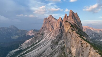 Wall Mural - View from above, stunning aerial view of the mountain range of Seceda during a beautiful sunset. The Seceda with its 2.500 meters is the highest vantage point in Val Gardena, Dolomites, Italy