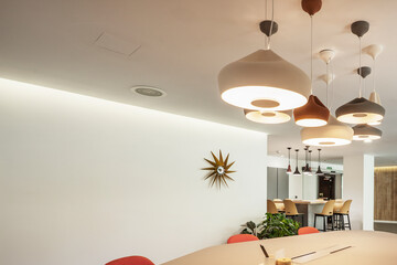 Sticker - Professional coworking office with many decorative ceiling lamps