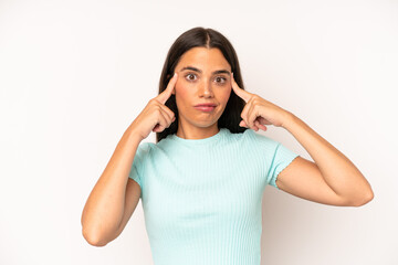 Wall Mural - hispanic pretty woman looking concentrated and thinking hard on an idea, imagining a solution to a challenge or problem