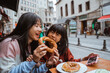 © Odua Images - mother and daughter enjoy playing while eating simit traditional bread of turkey in the morning