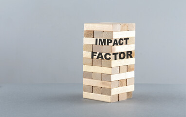Poster - IMPACT FACTOR text on a wooden block , grey background