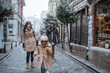 © Odua Images - happy asian family traveling in beautiful city during snow fall winter in turkey
