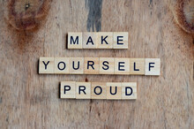 Make Yourself Proud Text On Wooden Square, Motivation Quotes