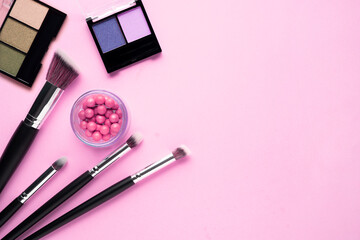 Wall Mural - Creative concept beauty fashion photo of cosmetic product make up brushes kit on pink background.