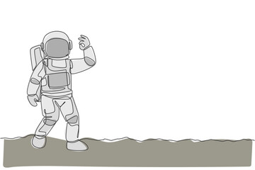 Poster - One single line drawing cosmonaut make okay gesture with his fingers in moon surface graphic vector illustration. Astronaut business office with outer space concept. Modern continuous line draw design