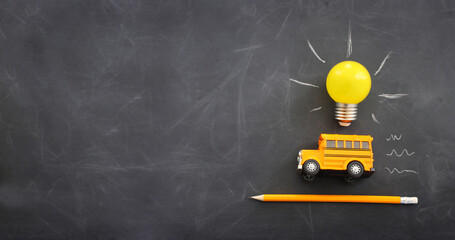 education. Back to school concept over wooden table and blackboard background