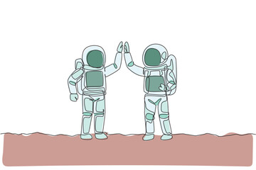 Poster - One continuous line drawing of two young happy astronauts giving high five gesture to celebrate teamwork in moon surface. Spaceman concept. Dynamic single line draw design vector graphic illustration