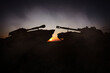 © New Africa - Silhouettes of tanks on battlefield in night