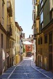 Fototapeta Miasta - Exterior of a modern and ancient architecture alley with colorful buildings in Spain
