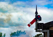 Railway Railroad Signal And Cloudy Sky