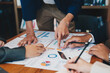 © Natee Meepian - business adviser meeting to analyze and discuss the situation on the financial report in the meeting room.Investment Consultant, Financial advisor and accounting concept