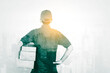 © Creativa Images - Double exposure of male courier holding package