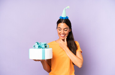 Wall Mural - pretty hispanic woman smiling with a happy, confident expression with hand on chin. birthday concept