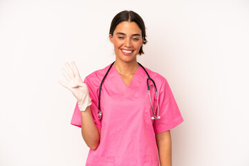 Wall Mural - pretty hispanic woman smiling and looking friendly, showing number four. veterinarian concept