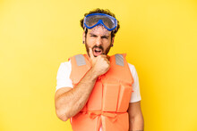 Crazy Bearded Man With Mouth And Eyes Wide Open And Hand On Chin. Life Jacket Concept