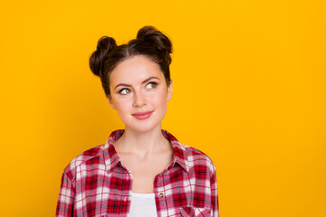 Poster - Photo of minded nice girl look interested empty space isolated on yellow color background