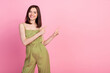 Photo of nice brunette lady index promo wear khaki overall isolated on pink color background