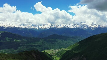 Wall Mural - Aerial view of Mestia village with green pasture against in Svaneti, Georgia.