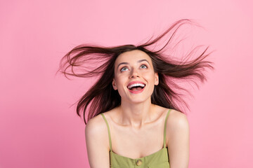 Sticker - Portrait of attractive cute shine cheerful girl wear khaki tank having fun throwing hair copy space isolated on pink color background