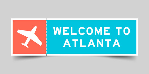 Orange and blue color ticket with plane icon and word welcome to atlanta on gray background