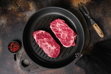 Wall Mural - Raw fresh meat Top Blade steaks, on old dark rustic table background, top view flat lay