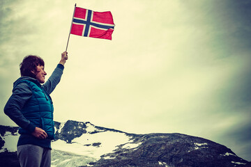 Sticker - Tourist with norwegian flag in mountains