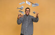 © denis_vermenko - Happy winner! Young rich african american man in casual t-shirt holding money dollar bills with surprise isolated over beige wall.