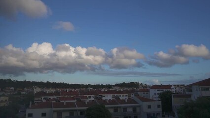 Wall Mural - Movement of clouds in the blue sky on a Portugal, Cascais. Time Lapse video.