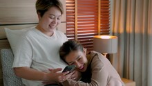 4K, An Asian Female Couple Are Expressing Their Joy And Love For Each Other As The Other Is Pregnant With Their First Child Through IVF. She Was Stroking Her Lover's Belly With Her Hand. LGBTQ Couples