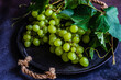 © ADDICTIVE STOCK - Ripe green grape on dark background