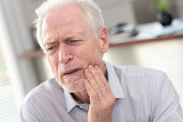 Senior man suffering from toothache
