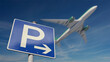 Parkplatz-Schild am Flughafen mit startendem Flugzeug