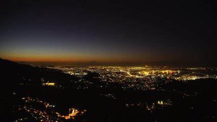 Wall Mural - Aerial Time Lapse Lockdown Shot Of Sparkling Residential City By Sea At Night - Rio de Janeiro, Brazil