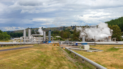 Wall Mural - Geothermal power plant steaming, green energy