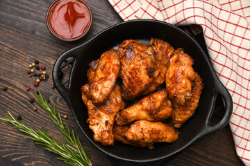 Spicy chicken wings with  ketchup