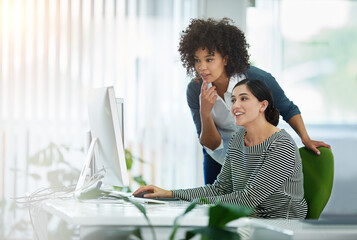 Poster - Young creative designers working together on a computer at a desk in a modern office. Women in design thinking, strategy and collaborating at work on a project with technology in the workplace.