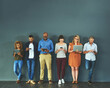 © Tamani Chithambo/peopleimages.com - Diverse group of people browsing social media on a phone, tablet and laptop in studio on a grey background. Networking, surfing the internet and posting online with wireless technology and copyspace