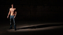Shadowplay. Series Of Images Of Casually Dressed Models In A Dark And Industrial Setting Experimenting With Light.