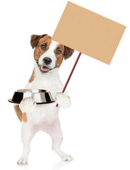 Poster - Jack Russell Terrier puppy holds empty bowl and shows empty placard. isolated on white background