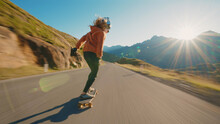 Cinematic Downhill Longboard Session. Young Woman Skateboarding And Making Tricks Between The Curves On A Mountain Pass. Concept About Extreme Sports And People