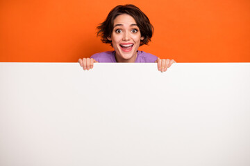 photo of astonished funky person impressed face stare speechless isolated on orange color background