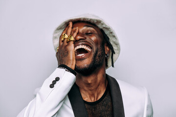 artistic portrait with gel lights. Handsome man posing on colored backgrounds. Artist singer performer posing for the album cover